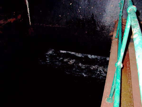 Nant power station - backsurge from tailrace in stoplog gate chamber